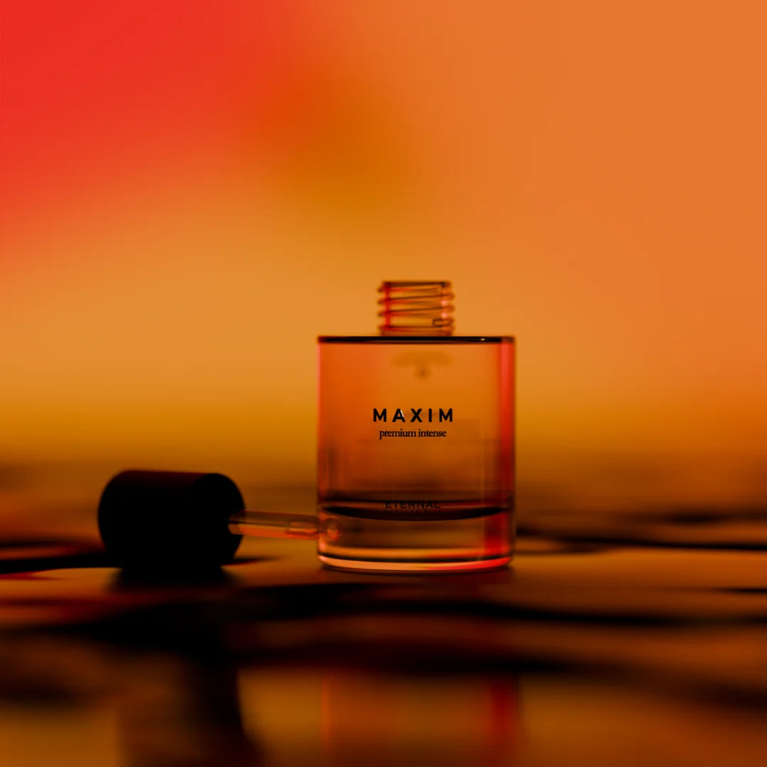Maxim Premium Intense perfume oil bottle with a dropper